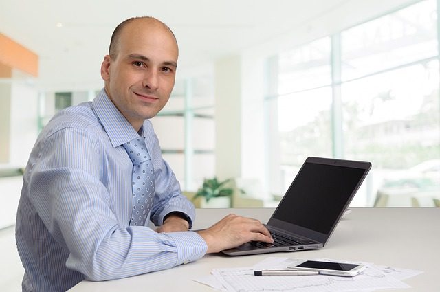 Man In Work On Laptop